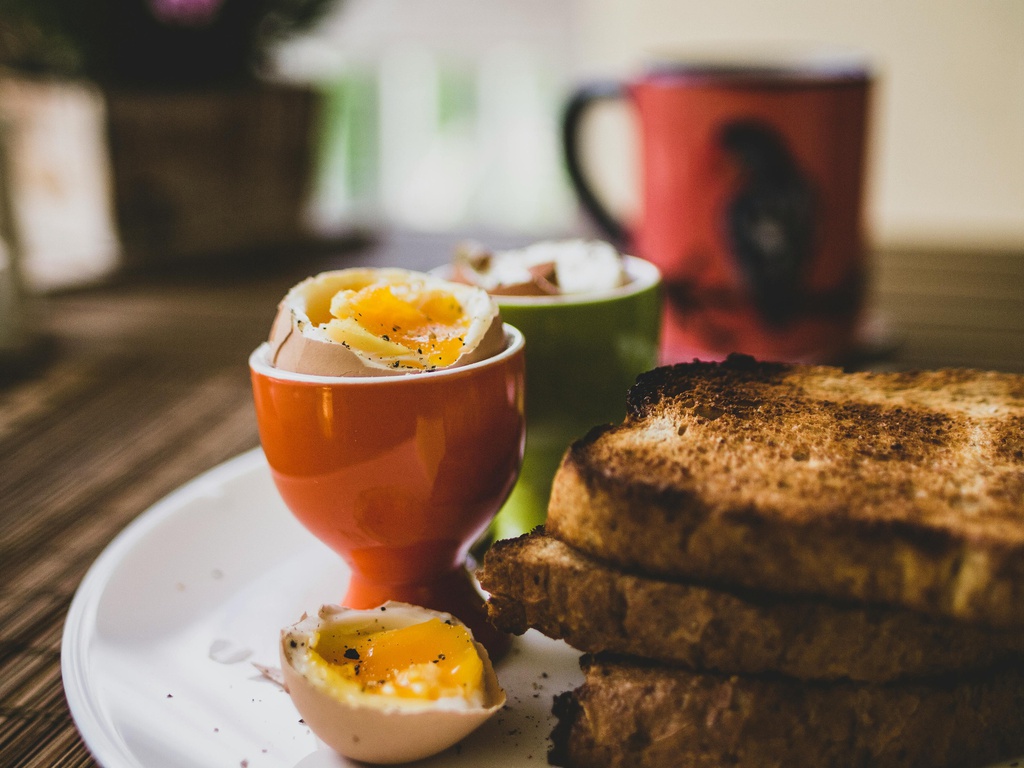 Soft-boiled egg with bread